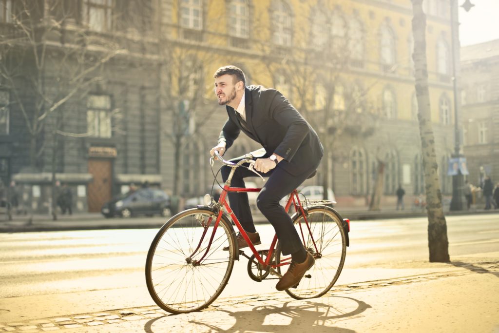 https://cdn.g4media.ro/wp-content/uploads/2019/12/man-in-black-suit-riding-bicycle-down-the-street-1843752-1024x683.jpg